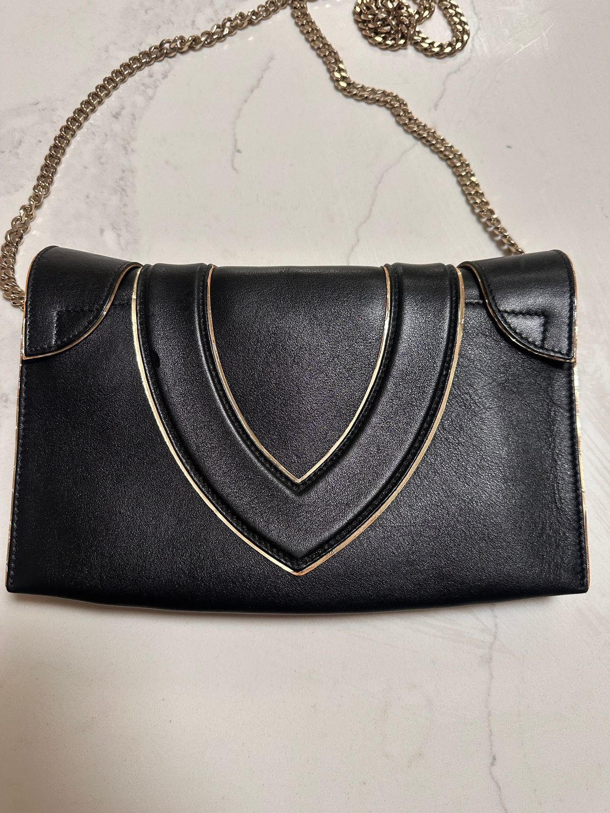 Elena Ghisellini Feline clutch in black leather with gold detail