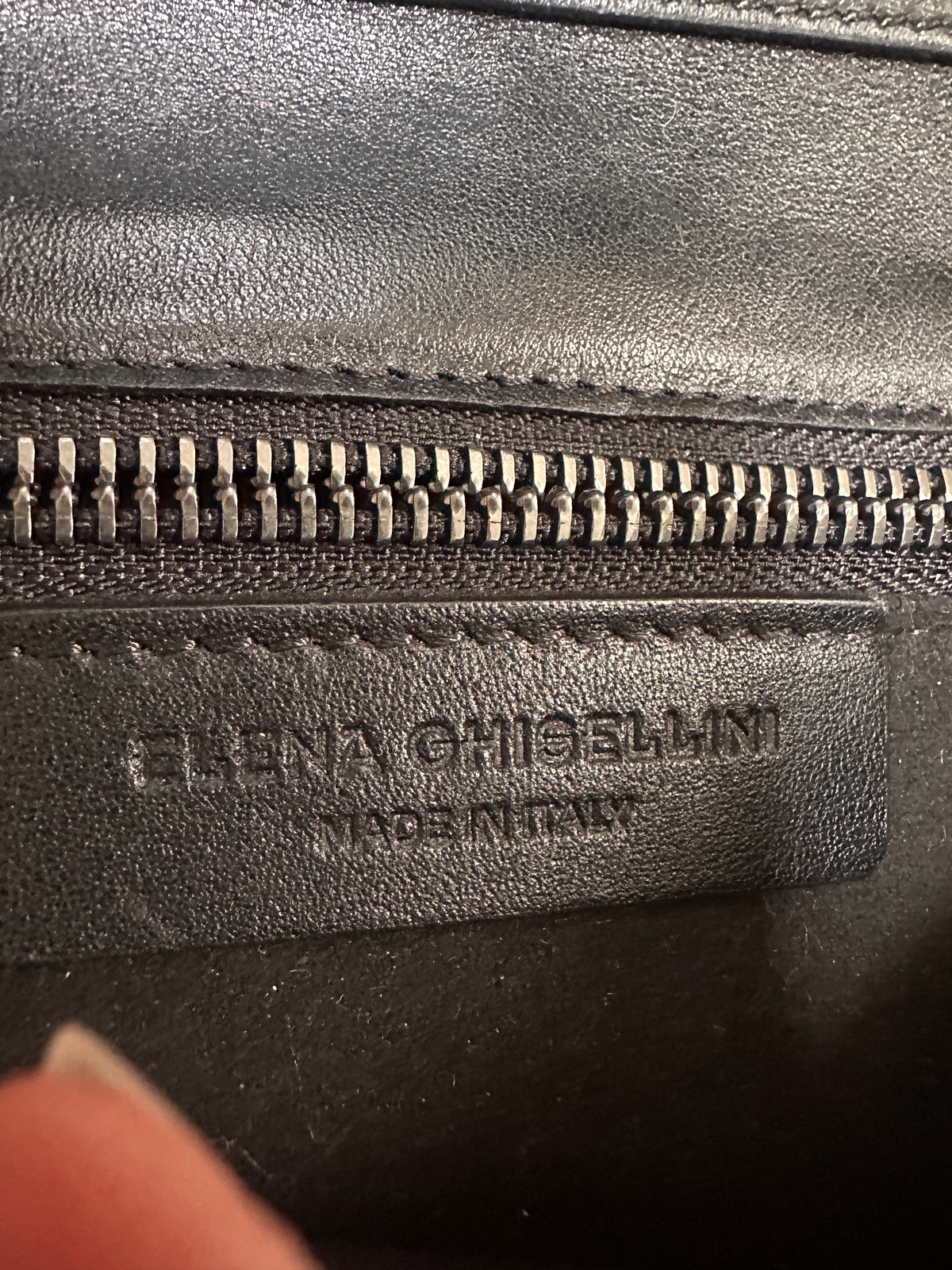 Elena Ghisellini Feline clutch in black leather with gold detail